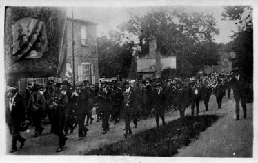 Armistice Day Parade 1918 | Clem Pack holding the Ancient Order of Foresters banner