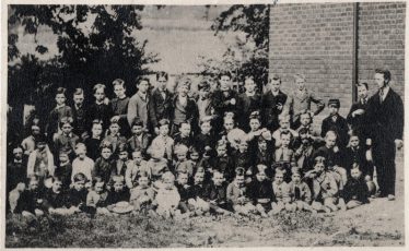 Pupils c.1876 with the headmaster, Mr Choate, standing on the right